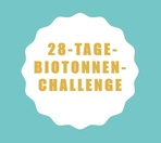 goldene Schrift "28 Tage-Biotonnen-Challenge" auf weißem Untergrund vor blauem Hintergrund